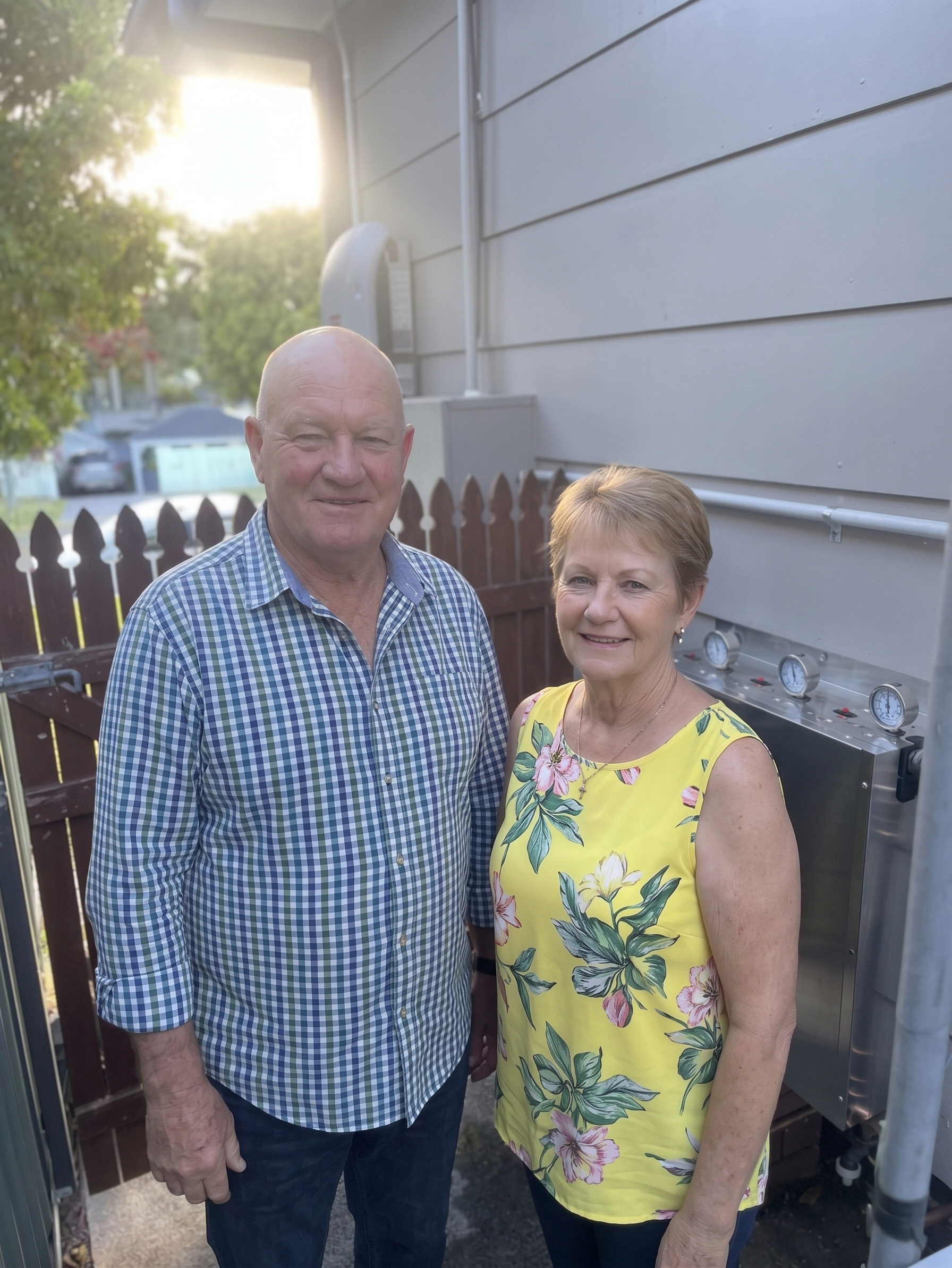 Customers beside a newly installed whole-house water filter in Rose Bay