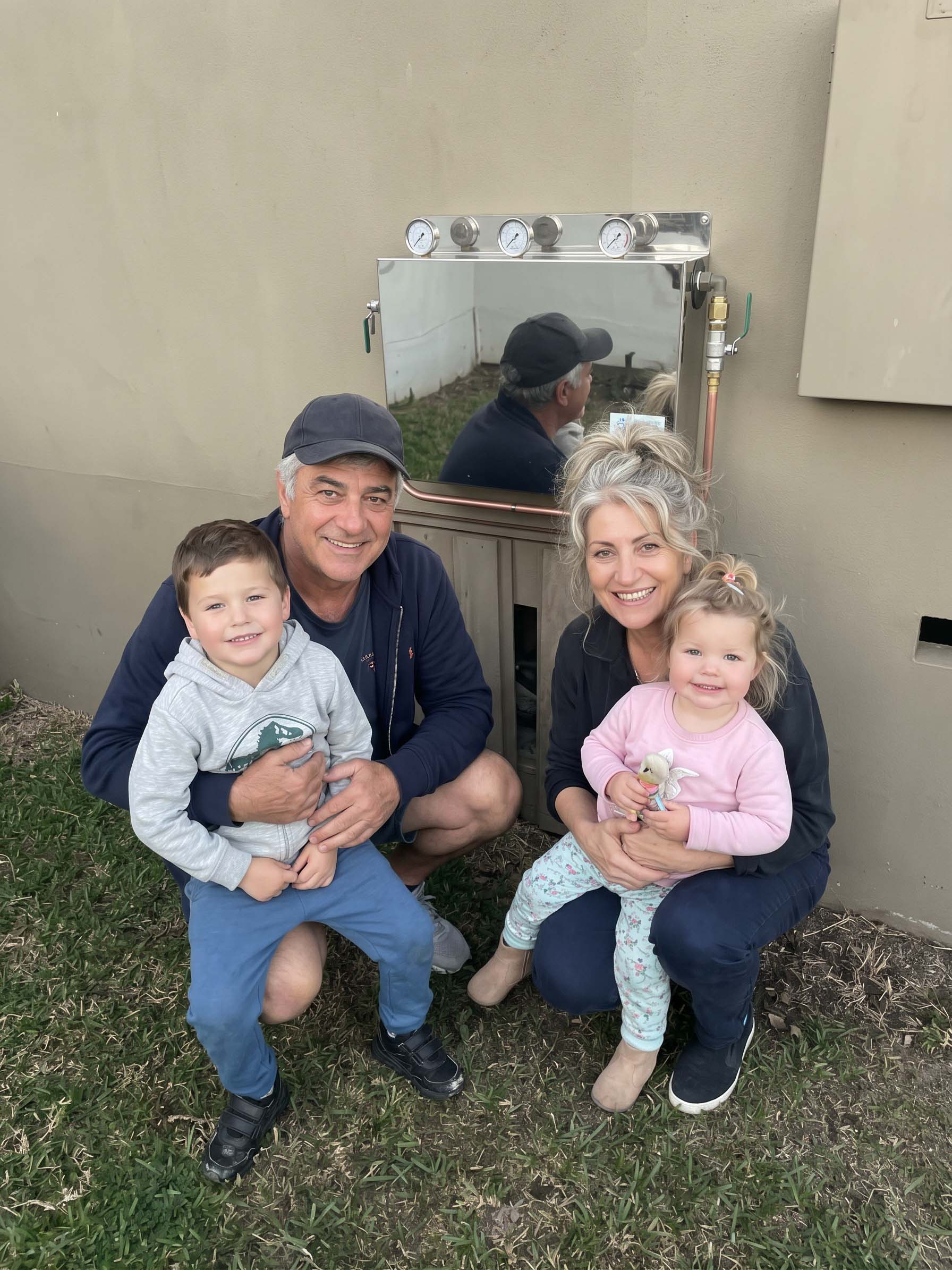 Customers beside a whole-house filtration system installed in the Sydney CBD